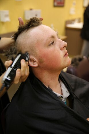 A new recruit with Delta Company, 1st Recruit Training Battalion, receives his initial haircut at Marine Corps Recruit Depot San Diego, April 3. Recruits receive haircuts immediately after arriving to create uniformity. Annually, more than 17,000 males recruited from the Western Recruiting Region are trained at MCRD San Diego. Delta Company is scheduled to graduate June 30.