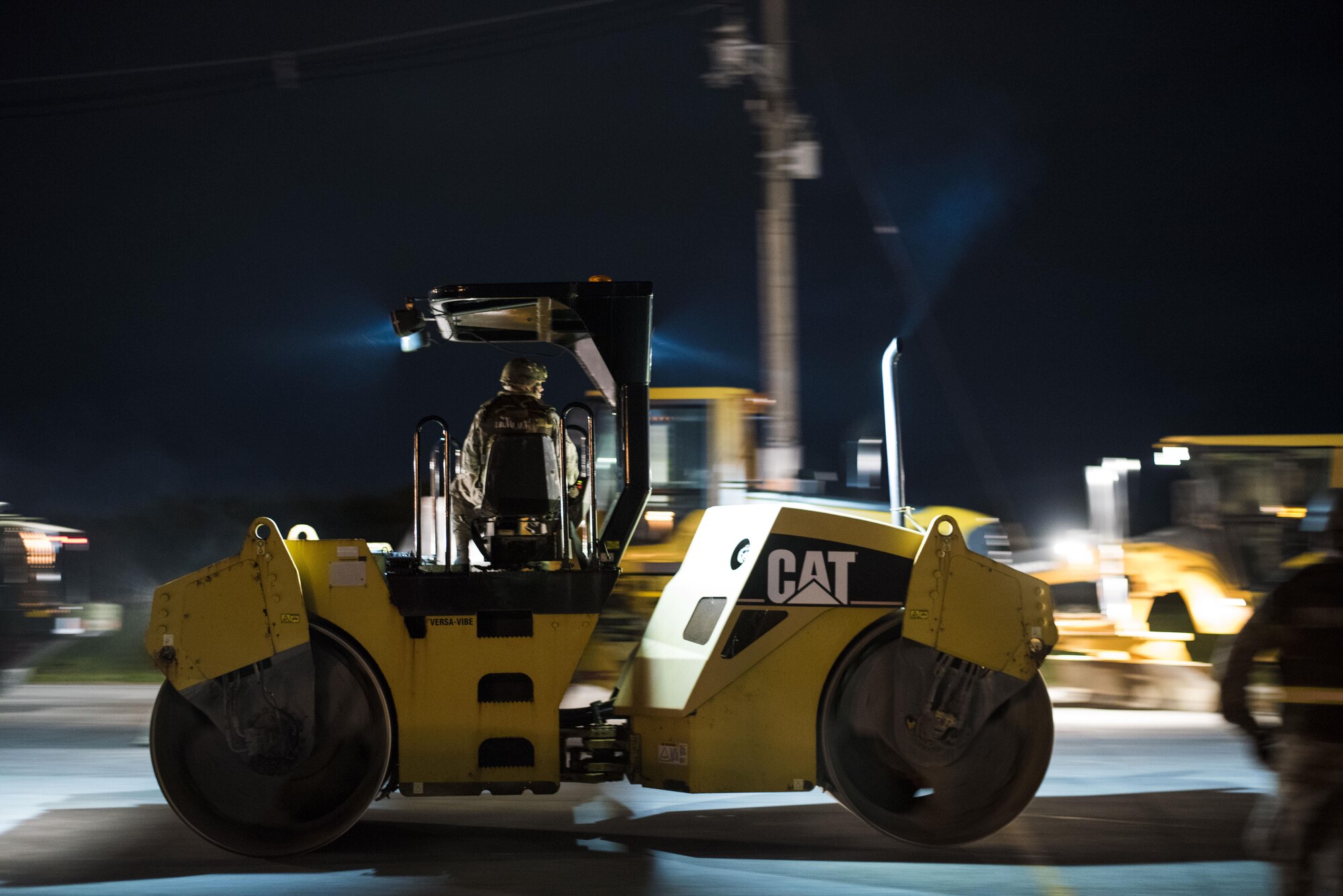 U.S. Air Force civil engineer Airmen mobilize heavy equipment for airfield damage repair during a no-notice exercise April 12, 2017, at Kadena Air Base Japan. Airmen from the 18th Civil Engineer Squadron conduct nighttime runway-repair training to ensure Kadena’s mission capabilities aren’t hindered from an attack, regardless of the time of day. (U.S. Air Force photo by Senior Airman Omari Bernard/Released)