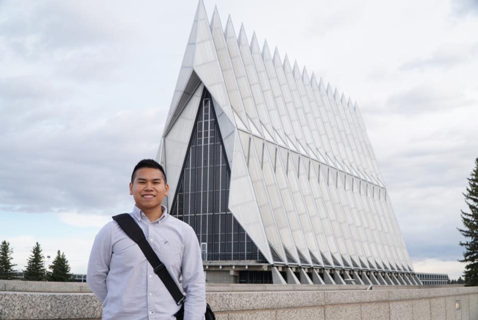 U.S. Air Force Senior Airman Patryk Myko Dela Cruz, a 35th Logistics Readiness Squadron mission generation vehicle equipment maintenance technician, stands in front of the U.S. Air Force Academy at Colorado Springs, Colorado, April, 2016. Dela Cruz did not make it the first time he applied, but with perseverance he did not give up and worked hard toward his goal until it was finally achieved. On March 8, 2017, he received his acceptance letter from his LEAD program counselor. (Courtesy Photo)