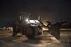 A U.S. Air Force civil engineer Airman operates heavy machinery to perform airfield damage repairs during a no-notice exercise April 12, 2017, at Kadena Air Base, Japan. The 18th Civil Engineer Squadron is capable of quickly repairing a damaged runway to ensure aircraft are able to take off and land safely. (U.S. Air Force photo by Senior Airman Omari Bernard/Released)