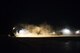 U.S. Air Force civil engineer Airmen use specialized equipment to clear debris from a runway during a no-notice exercise April 12, 2017, at Kadena Air Base, Japan. During the airfield damage repair portion of the exercise, the 18th CES trains throughout the night to ensure mission capability in all conditions. (U.S. Air Force photo by Senior Airman Omari Bernard/Released)