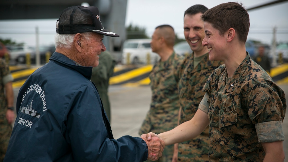 Donald Irwin, a U.S. Navy veteran of World War II, shakes 1st Lt. Lauren Campbell’s hand, April 7, 2017, on Marine Corps Air Station Futenma, Okinawa, Japan. Irwin, who served aboard a number of ships during World War II, fought at Midway and Guadalcanal and survived the sinking of the USS Colhoun during the Battle of Okinawa. Irwin returned to Okinawa and exchanged stories with the Marines and Sailors stationed on the island. Irwin is a native of San Jose, California, and Campbell, a native of Redwood City, California, is a material control officer with Marine Medium Tiltrotor Squadron 265, Marine Aircraft Group 36, 1st Marine Aircraft Wing, III Marine Expeditionary Force.