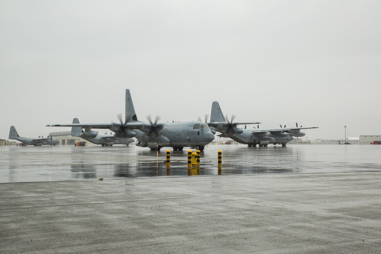 A U.S. Marine Corps KC-130J Hercules with Marine Aerial Refueler Transport Squadron (VMGR) 152, taxis to the flight line during aviation delivered ground refueling training with Marine Fighter Attack Squadron (VMFA) 121 at Marine Corps Air Station Iwakuni, Japan, April 11, 2017. The ADGR marked the first evolution of this form of refueling for VMFA-121’s F-35B Lightning II aircraft, and it increases the squadron’s ability to refuel by C-130 aircraft in austere locations when other resources may not be available.  (U.S. Marine Corps photo by Lance Cpl. Joseph Abrego)