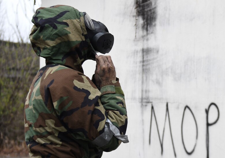 U.S. Army Pfc. Jae Won Choi, 6th Battalion, 52nd Air Defense Artillery medic, dons his Mission Oriented Protective Posture gear in a simulated contaminated environment during the 35th Air Defense Artillery Brigade Expert Field Medical Badge preliminary competition at Osan Air Base, Republic of Korea, April 6, 2017. The goal of the competition was to bring together medics for training and determine which have the ability and resolve to win at the 8th Army’s Expert Field Medical Badge Competition. (U.S. Air Force photo by Staff Sgt. Alex Fox Echols III)