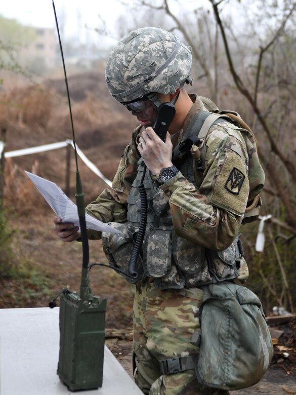 U.S. Army Pfc. Jae Won Choi, 6th Battalion, 52nd Air Defense Artillery medic, sends a simulated medevac request during the 35th Air Defense Artillery Brigade Expert Field Medical Badge preliminary competition at Osan Air Base, Republic of Korea, April 6, 2017. The competition was a first for the 35th ADA, and it gave Soldiers an opportunity to flush out their weaknesses and capitalize on their strengths in the field medic realm. (U.S. Air Force photo by Staff Sgt. Alex Fox Echols III)