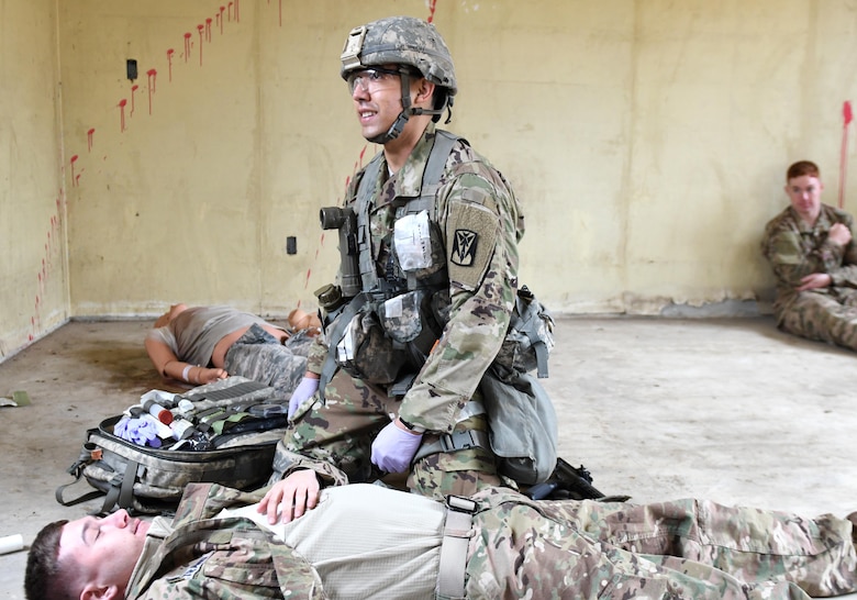 U.S. Army Staff Sgt. Santiago Sendejas, 6th Battalion, 52nd Air Defense Artillery medical NCO in charge, manages a multi-casualty scenario during the 35th Air Defense Artillery Brigade Expert Field Medical Badge preliminary competition at Osan Air Base, Republic of Korea, April 6, 2017. During the competition, participants had to overcome two combat trauma lanes, testing the medic’s abilities, determination and strength through scenarios such as medical management, care under fire, tactical movement, decontamination and litter movement. (U.S. Air Force photo by Staff Sgt. Alex Fox Echols III)