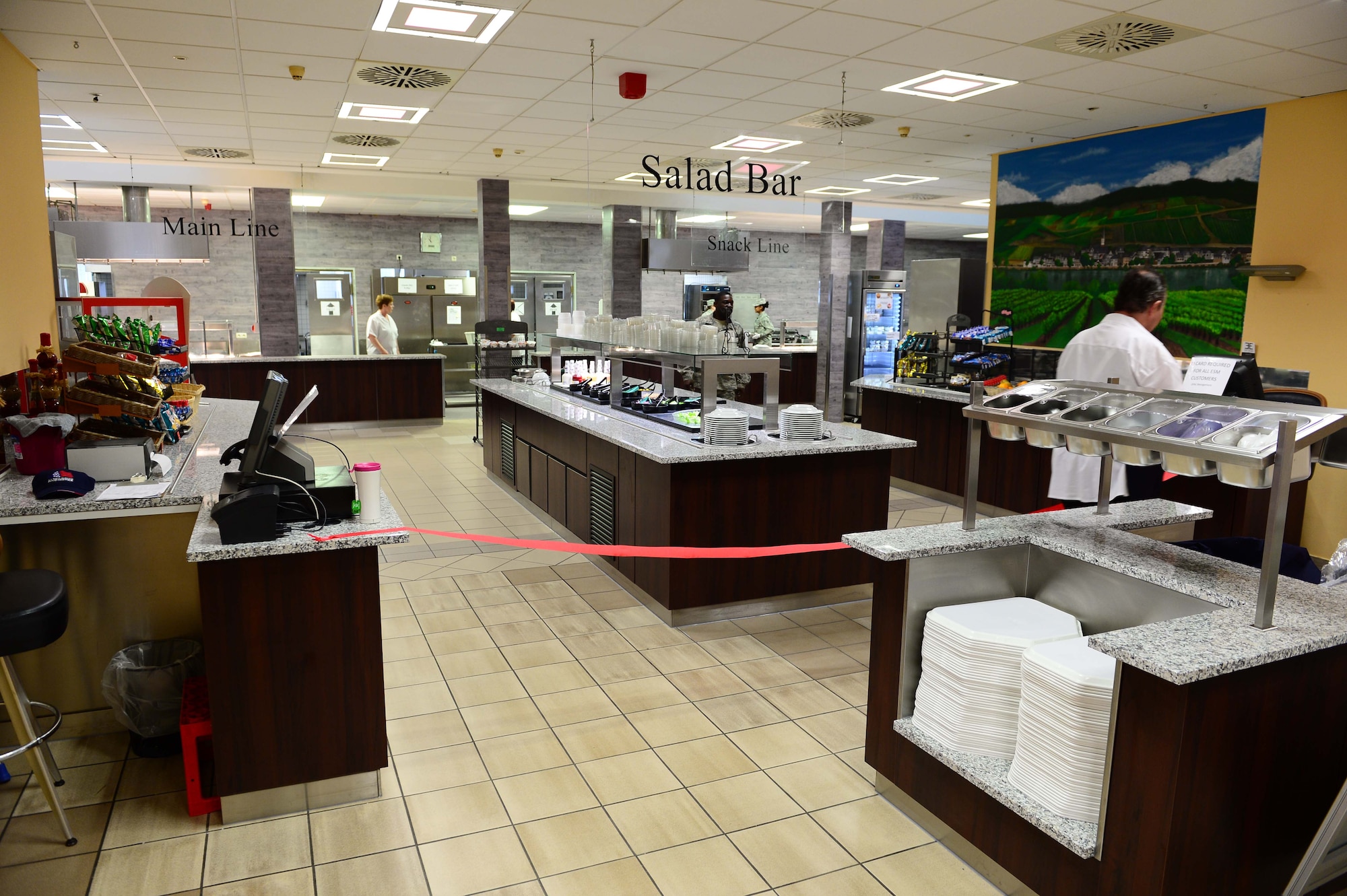 The Dining Facility at Spangdahlem Air Base opened its doors once again after several months of renovations that made meal service unavailable to the Saber community, April 10, 2017. Upgrades to the DFAC include new kitchen equipment like ovens and a walk in fridge, air conditioning installed in the kitchen, a new service line, repainting the walls and adding murals in the dining rooms to reflect the base's connection to the local community. (U.S. Air Force photo by Senior Airman Joshua R. M. Dewberry)