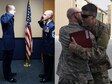 U.S. Air Force Chief Master Sgt. Shawn Ricchuito, fire chief with the 379th Expeditionary Civil Engineer Squadron Fire Department, and his son U.S. Air Force 1st Lt. Devin Ricchuito, a clinical nurse with the 455th Expeditionary Medical Group, share a moment in two different photos taken years apart. Devin transited through Al Udeid AB for his first deployment and was reunited with his father, who is stationed there for his last deployment. (U.S. Air Force photo illustration by Senior Airman Cynthia A. Innocenti)