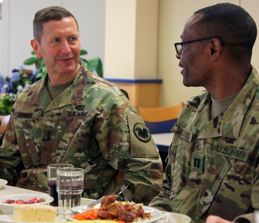 Maj. Gen. David Conboy, United States Army Reserve Command deputy commanding general - operations, speaks with Capt. Jean Segning, logistics officer, 7th Mission Support Command, April 8 at the Clock Tower Dining Facility. Conboy visited the command April 8-9 in order to be briefed on the MSC’s readiness. 