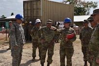 Master Sgt. Jennifer Trumbull, attached to the 672nd Engineer Company from Missoula, Montana, briefs BG Alberto C Rosende and other senior leaders on their work project during Beyond the Horizon: 2017-Belize, April 6. During their rotation, U.S. Army Reserve Soldiers laid the foundation for the new, three classroom addition to the St. Matthews Government School.
