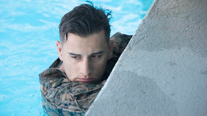 A Marine prepares for a 600 meter conditioning swim during Water Survival-Advanced training at Marine Corps Base Camp Lejeune, N.C., April 4, 2017. WSA is a week-long course that tests Marines on rescues, strokes and distance swimming. The Marine is a student in the course, which is run by 2nd Law Enforcement Battalion. 