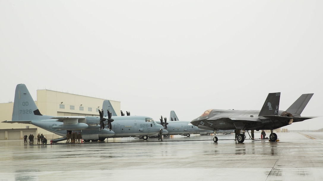 A U.S. Marine Corps F-35B Lightning II aircraft with Marine Fighter Attack Squadron 121 refuels using a KC-130J Hercules with Marine Aerial Refueler Transport Squadron 152 during aviation delivered ground refueling training at Marine Corps Air Station Iwakuni, Japan, April 11, 2017. The ADGR marked the first evolution of this form of refueling for VMFA-121’s F-35B Lightning II aircraft, and it increases the squadron’s ability to refuel by C-130 aircraft in austere locations when other resources may not be available. 