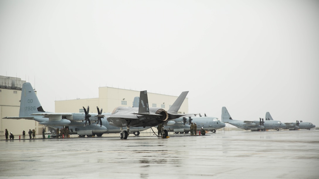 A U.S. Marine Corps F-35B Lightning II aircraft with Marine Fighter Attack Squadron 121 refuels using a KC-130J Hercules with Marine Aerial Refueler Transport Squadron 152 during aviation delivered ground refueling training at Marine Corps Air Station Iwakuni, Japan, April 11, 2017. The ADGR marked the first evolution of this form of refueling for VMFA-121’s F-35B Lightning II aircraft, and it increases the squadron’s ability to refuel by C-130 aircraft in austere locations when other resources may not be available.  