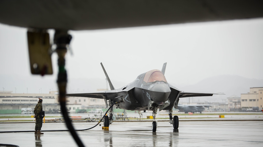 A U.S. Marine Corps F-35B Lightning II aircraft with Marine Fighter Attack Squadron 121 refuels using a KC-130J Hercules with Marine Aerial Refueler Transport Squadron 152 during aviation delivered ground refueling training at Marine Corps Air Station Iwakuni, Japan, April 11, 2017. The ADGR marked the first evolution of this form of refueling for VMFA-121’s F-35B Lightning II aircraft, and it increases the squadron’s ability to refuel by C-130 aircraft in austere locations when other resources may not be available.  