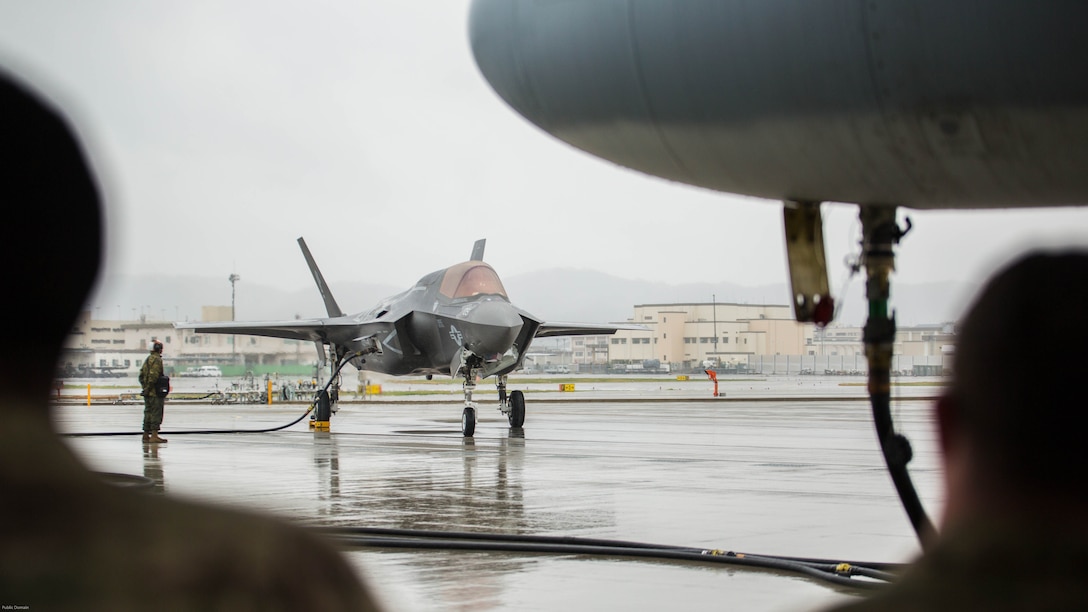 A U.S. Marine Corps F-35B Lightning II aircraft with Marine Fighter Attack Squadron 121 refuels using a KC-130J Hercules with Marine Aerial Refueler Transport Squadron 152 during aviation delivered ground refueling training at Marine Corps Air Station Iwakuni, Japan, April 11, 2017. The ADGR marked the first evolution of this form of refueling for VMFA-121’s F-35B Lightning II aircraft, and it increases the squadron’s ability to refuel by C-130 aircraft in austere locations when other resources may not be available.  