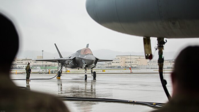 A U.S. Marine Corps F-35B Lightning II aircraft with Marine Fighter Attack Squadron 121 refuels using a KC-130J Hercules with Marine Aerial Refueler Transport Squadron 152 during aviation delivered ground refueling training at Marine Corps Air Station Iwakuni, Japan, April 11, 2017. The ADGR marked the first evolution of this form of refueling for VMFA-121’s F-35B Lightning II aircraft, and it increases the squadron’s ability to refuel by C-130 aircraft in austere locations when other resources may not be available.  