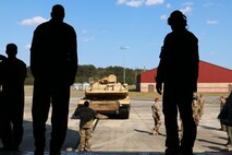 Airmen watch as Soldiers from 2nd Battalion, 7th Infantry Regiment, 1st Armored Brigade Combat Team, 3rd Infantry Division prepare to load an M1A1 Abrams tank onto a C5 "Super Galaxy" aircraft March 28, 2017 at Hunter Army Airfield, Ga. Airmen of 9th Airlift Squadron, 436th Airlift Wing out of Dover Air Force Base, Del., coordinated air support with to support 2-7th Inf. air load training for their Immediate Ready Company. The IRC maintains readiness to support the Global Response Force within 18 hours of notification. (U.S. Army photo by Staff Sgt. Candace Mundt/Released)