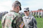 Spc. Lauren E. Kopetzky of the Iowa Army National Guard, receives the Iowa National Guard Medal of Merit from Brig. Gen. Steve Altman, Deputy Commanding General for Maneuver, on April 9, 2017, at the Camp Dodge Joint Maneuver Training Center, in Johnston, Iowa. Kopetzky was recognized for providing aid to a shooting victim in Ames, Iowa, on August 9, 2016. 