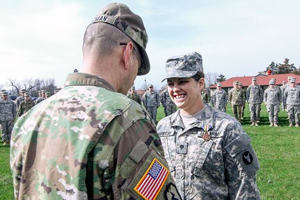 Spc. Lauren E. Kopetzky of the Iowa Army National Guard, receives the Iowa National Guard Medal of Merit from Brig. Gen. Steve Altman, Deputy Commanding General for Maneuver, on April 9, 2017, at the Camp Dodge Joint Maneuver Training Center, in Johnston, Iowa. Kopetzky was recognized for providing aid to a shooting victim in Ames, Iowa, on August 9, 2016. 