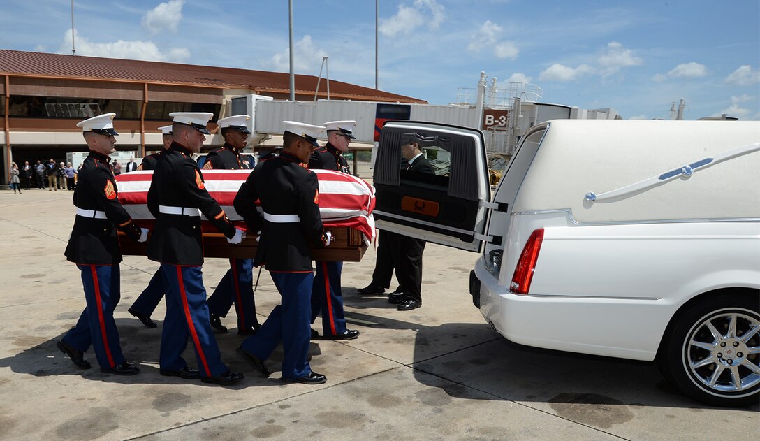 Marines attached to Marine Corps Logistics Base Albany funeral detail transport a casket with the remains of Marine Pfc. James O. Whitehurst from an aircraft to a hearse at the Tallahassee International Airport in Tallahassee, Fla., April 11. Whitehurst was killed in action at the battle of Tarawa during World War II, Nov. 20, 1943.