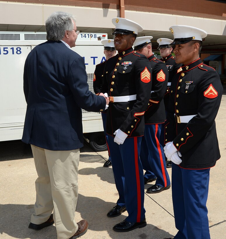 A family member of fallen Marine Pfc. James O. Whitehurst, who was killed in action Nov. 20, 1943, at the battle of Tarawa during World War II, thanks Marine Corps Logistics Base Albany funeral detail member for rendering plane-side honors, April 11. 