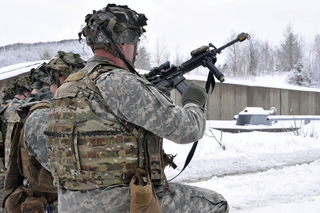 Soldiers load their weapons before conducting squad-level training at Camp Ethan Allen Training Site in Jericho, Vt., April 8, 2017. Army National Guard photo by Staff Sgt. Ashley Hayes