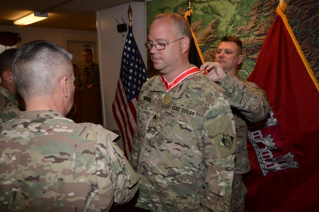 West resident Arnold “Rob” Newman, deputy chief for the Programs and Project Management Division, U.S. Army Corps of Engineers – Transatlantic Afghanistan District (USACE-TAA), receives the U.S. Army Engineer Association’s de Fleury Medal from Lt. Gen. Todd Semonite (left), chief of Army engineers and commander, USACE headquarters, and Col. Jon Chytka (right), commander, USACE-TAA, at a ceremony on Bagram Airfield, Afghanistan, Apr. 7. The de Fleury Medal is one of the highest honors awarded by USACE, and represents long-term contributions to the U.S. Army Engineer Regiment.