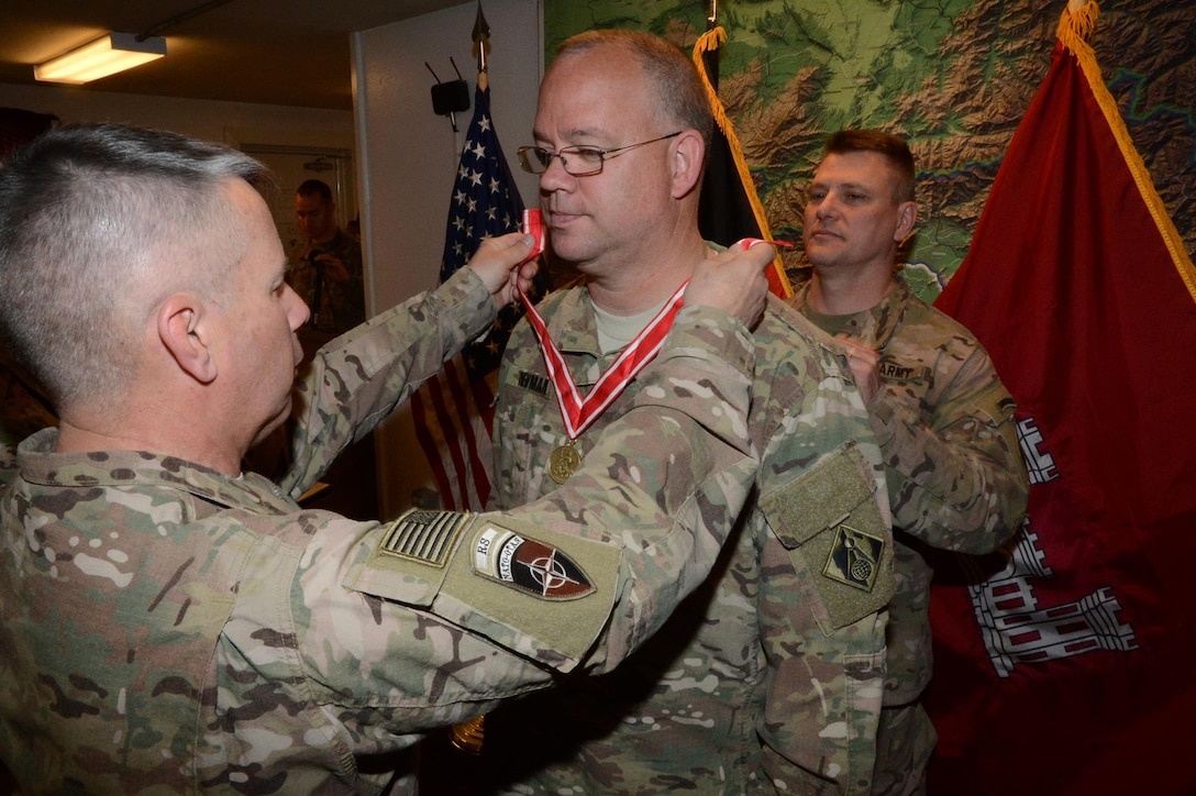 West resident Arnold “Rob” Newman, deputy chief for the Programs and Project Management Division, U.S. Army Corps of Engineers – Transatlantic Afghanistan District (USACE-TAA), receives the U.S. Army Engineer Association’s de Fleury Medal from Lt. Gen. Todd Semonite (left), chief of Army engineers and commander, USACE headquarters, and Col. Jon Chytka (right), commander, USACE-TAA, at a ceremony on Bagram Airfield, Afghanistan, Apr. 7. The de Fleury Medal is one of the highest honors awarded by USACE, and represents long-term contributions to the U.S. Army Engineer Regiment.