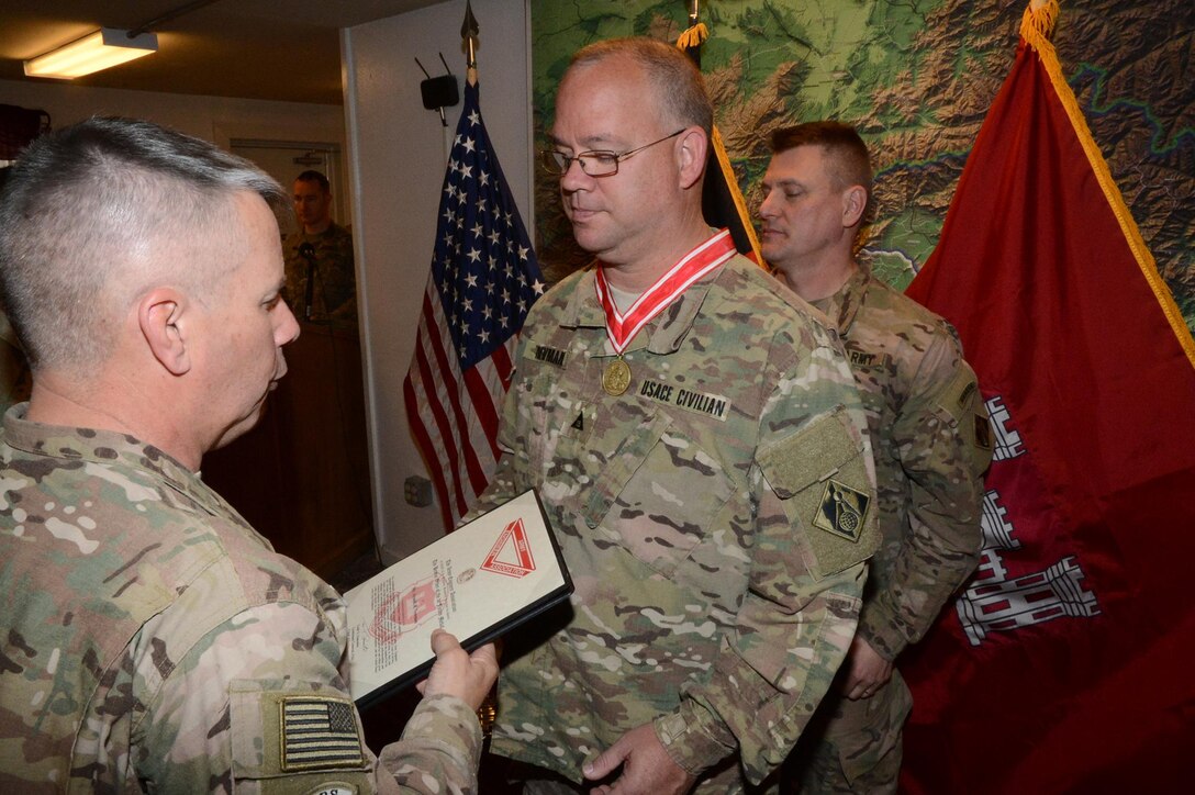 West resident Arnold “Rob” Newman, deputy chief for the Programs and Project Management Division, U.S. Army Corps of Engineers – Transatlantic Afghanistan District (USACE-TAA), receives the U.S. Army Engineer Association’s de Fleury Medal from Lt. Gen. Todd Semonite (left), chief of Army engineers and commander, USACE headquarters, and Col. Jon Chytka (right), commander, USACE-TAA, at a ceremony on Bagram Airfield, Afghanistan, Apr. 7. The de Fleury Medal is one of the highest honors awarded by USACE, and represents long-term contributions to the U.S. Army Engineer Regiment.