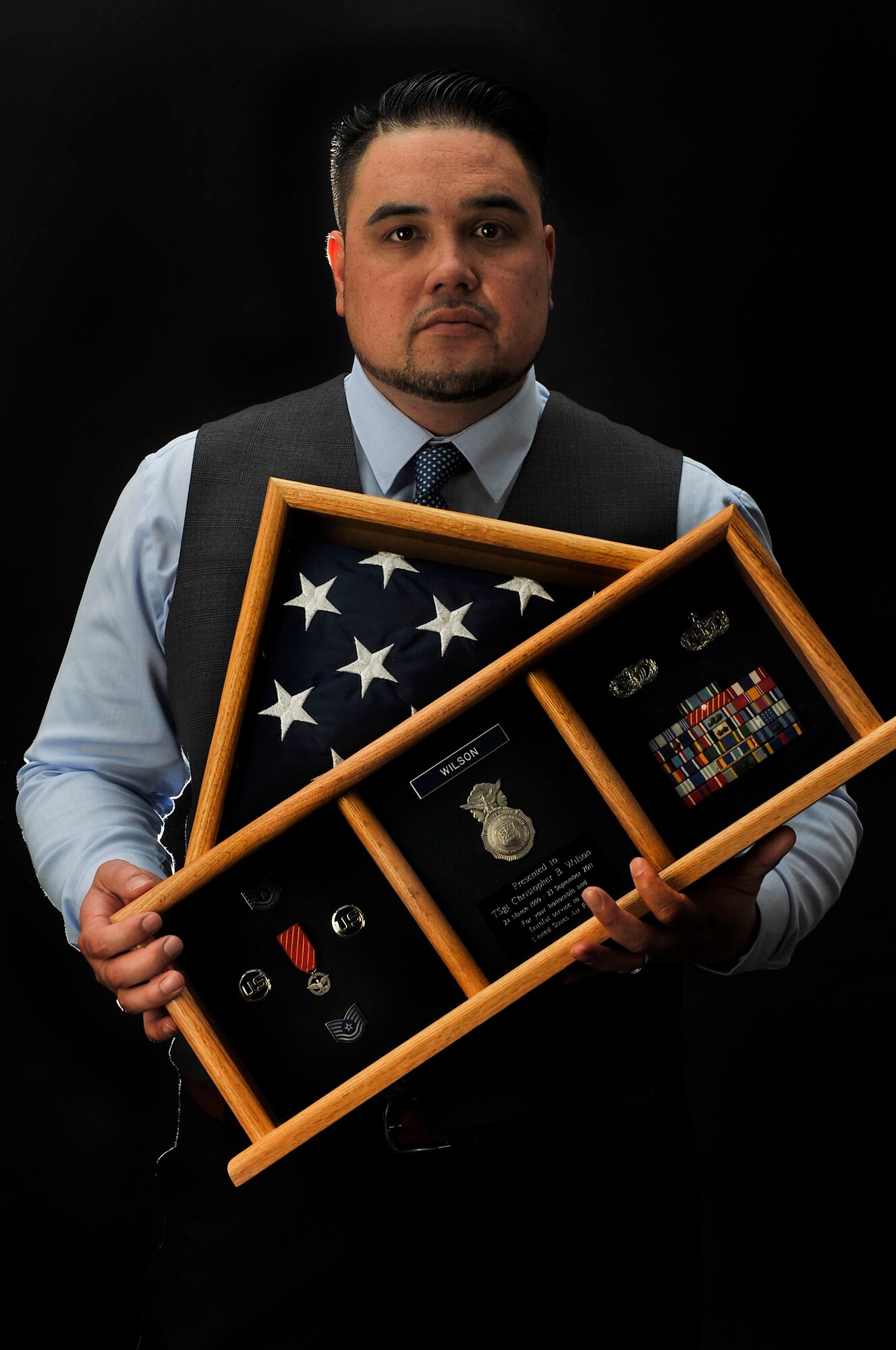 Chris Wilson, 100th Air Refueling Wing Information Security specialist, poses for a photograph April 7, 2017, on RAF Mildenhall, England. Wilson served as an active-duty security forces Airman until he was medically retired due to injuries caused by a drunk driver. (U.S. Air Force photo by Airman 1st Class Tenley Long)