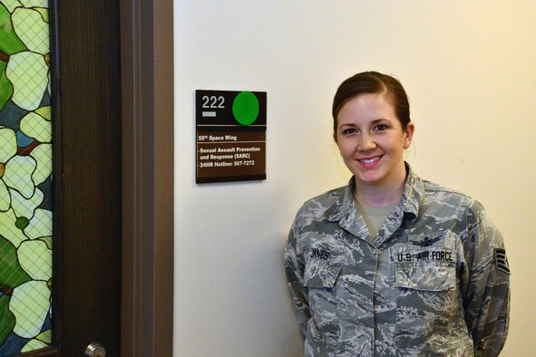 SCHRIEVER AIR FORCE BASE, Colo.-- Staff Sgt. Velnette Janes, Schriever volunteer victim advocate, stands outside the Sexual Assault Response and Prevention Office at Schriever Air Force Base, Colorado, Tuesday, April 11, 2017. Volunteer victim advocates provide a range of support services for sexual assault survivors, and help victims try to regain a sense of normalcy following an assault. (U.S. Air Force photo/Brian Hagberg)