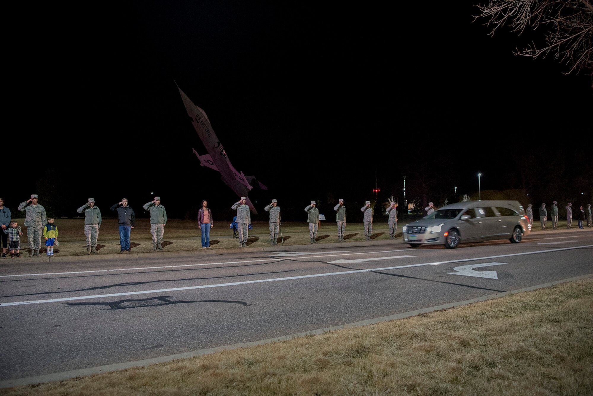 PETERSON AIR FORCE BASE, Colo. – Members of Team Pete salute during a dignified transfer as the remains of SSgt. Austin Bieren, a 21st Space Wing security forces Airman, pass them at Peterson Air Force Base, Colo., April 7, 2017. Bieren died in a non-combat related incident while deployed in support of combat operations March 28, 2017. (U.S. Air Force photo by Steve Kotecki) 