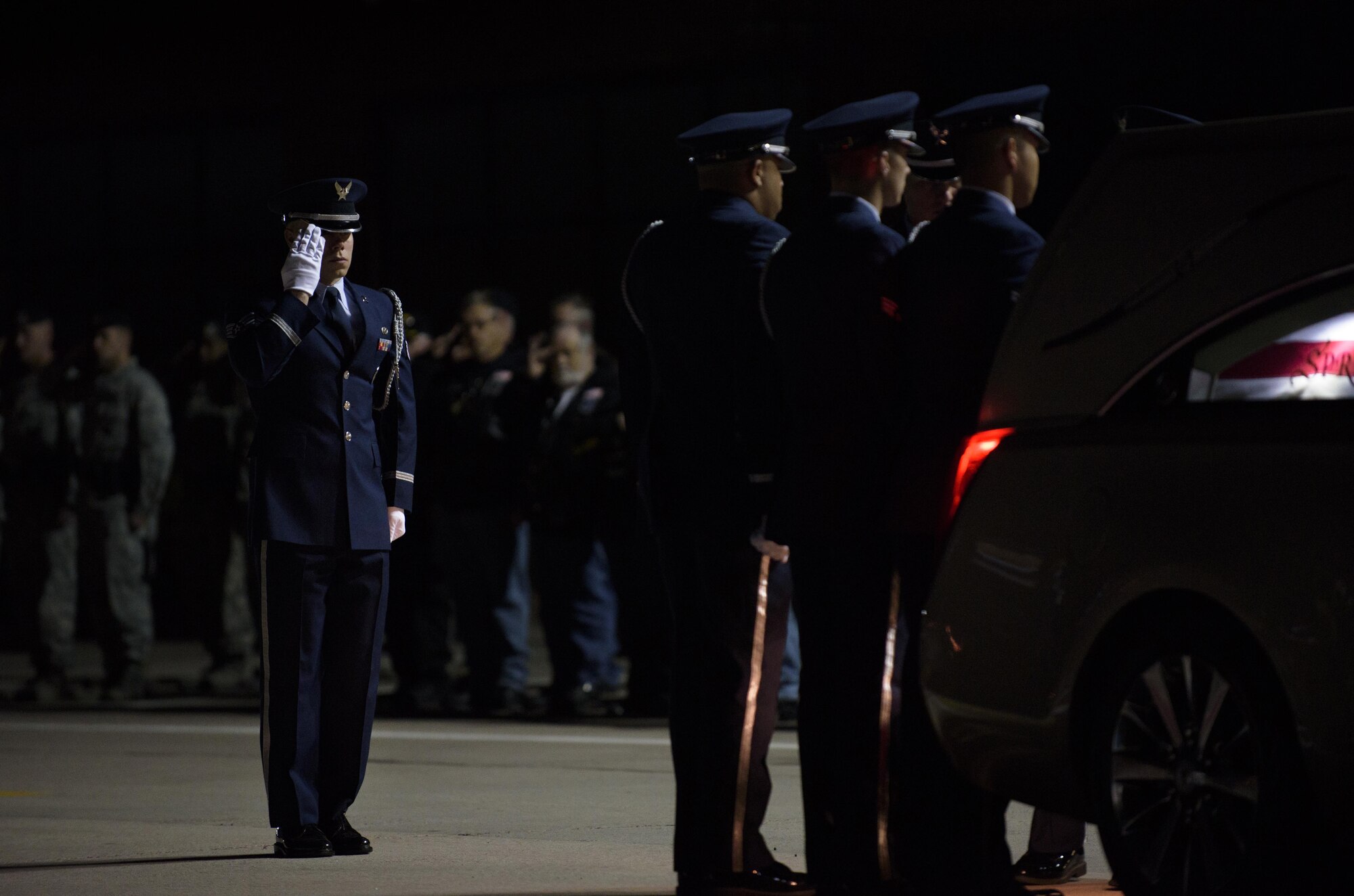 PETERSON AIR FORCE BASE, Colo. – An Airmen with the Peterson Air Force Base’s Honor Guard renders a salute as Honor Guardsmen transfer the remains of Staff Sgt. Austin Bieren, of Umatilla, Ore., April 7, 2017, at Peterson AFB, Colo. Bieren was assigned to the 21st Space Wing as a security forces Airman and died in a non-combat related incident while deployed in support of combat operations March 28, 2017. (U.S. Air Force photo by Airman 1st Class Dennis Hoffman) 