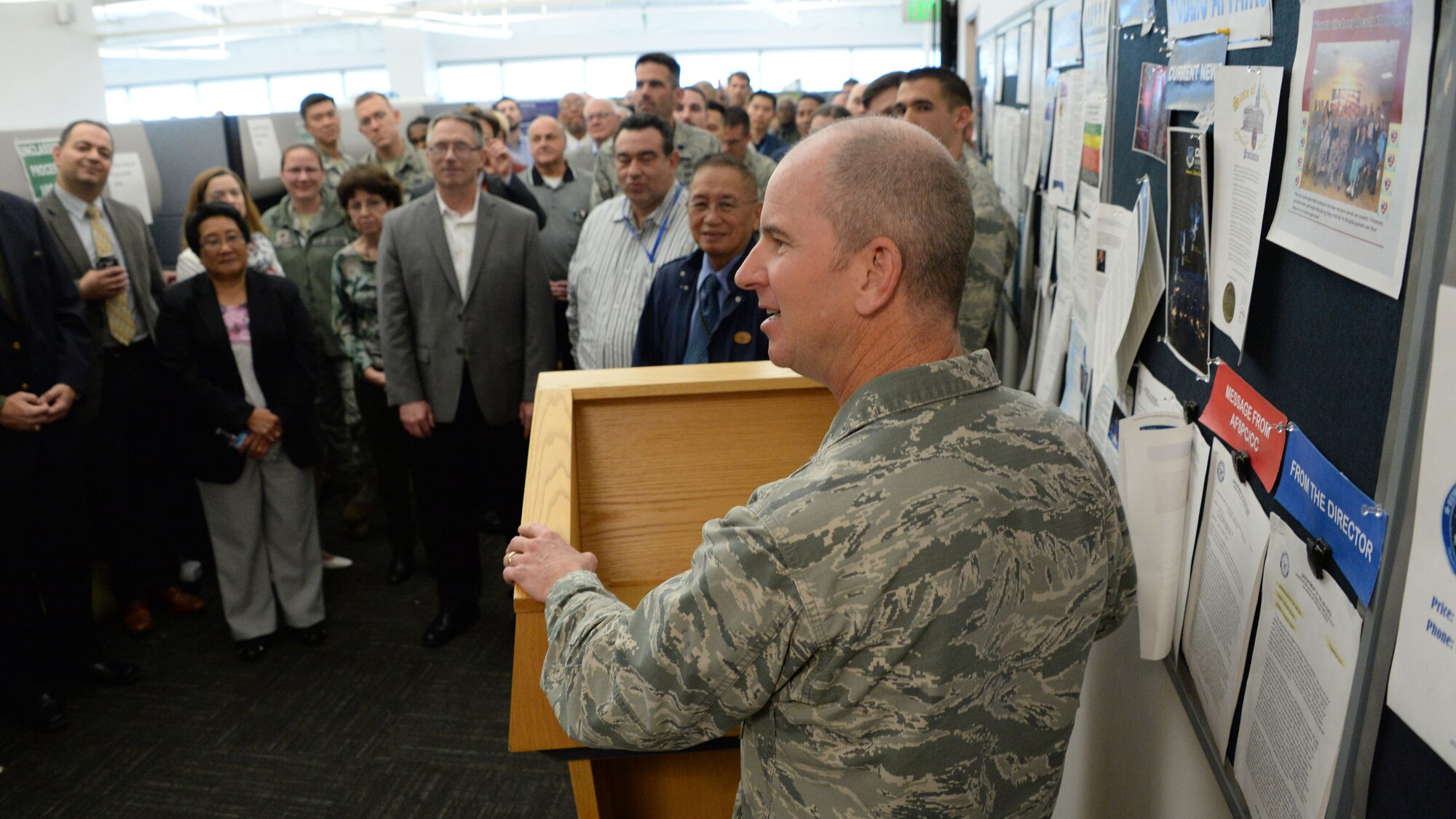 Col. Dennis Bythewood, director of the Space and Missile Systems Center’s Remote Sensing Systems Directorate, addresses an audience of RS personnel prior to the unveiling of the new Remote Sensing Heritage Wall at Los Angeles Air Force Base in El Segundo, Calif., March 15, 2017. The ceremony commemorates an SMC mission that spans nearly six decades of providing global, persistent, infrared surveillance and environmental monitoring capabilities to our warfighters and the nation. (U.S. Air Force photo / Van De Ha)