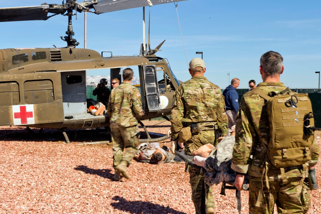 Special operations medics evacuate a simulated casualty to a helicopter during a training exercise at Fort Carson, Colo., April 6, 2017. Army photo by Staff Sgt. Will Reinier