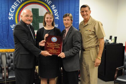 141020-N-ZZ999-001 WASHINGTON (Oct. 20, 2014) Assistant Secretary of the Navy for Energy, Installations, and Environment Dennis McGinn presents the Safety Integration in Acquisition Award at the Pentagon to Rebecca Funkhouser and Robert Heflin from the System Safety Engineering Division Team, Dahlgren Division, Naval Surface Warfare Center, and Vice Adm. William Hilarides, commander of Naval Sea Systems Command. (U.S. Navy photo/Released) 