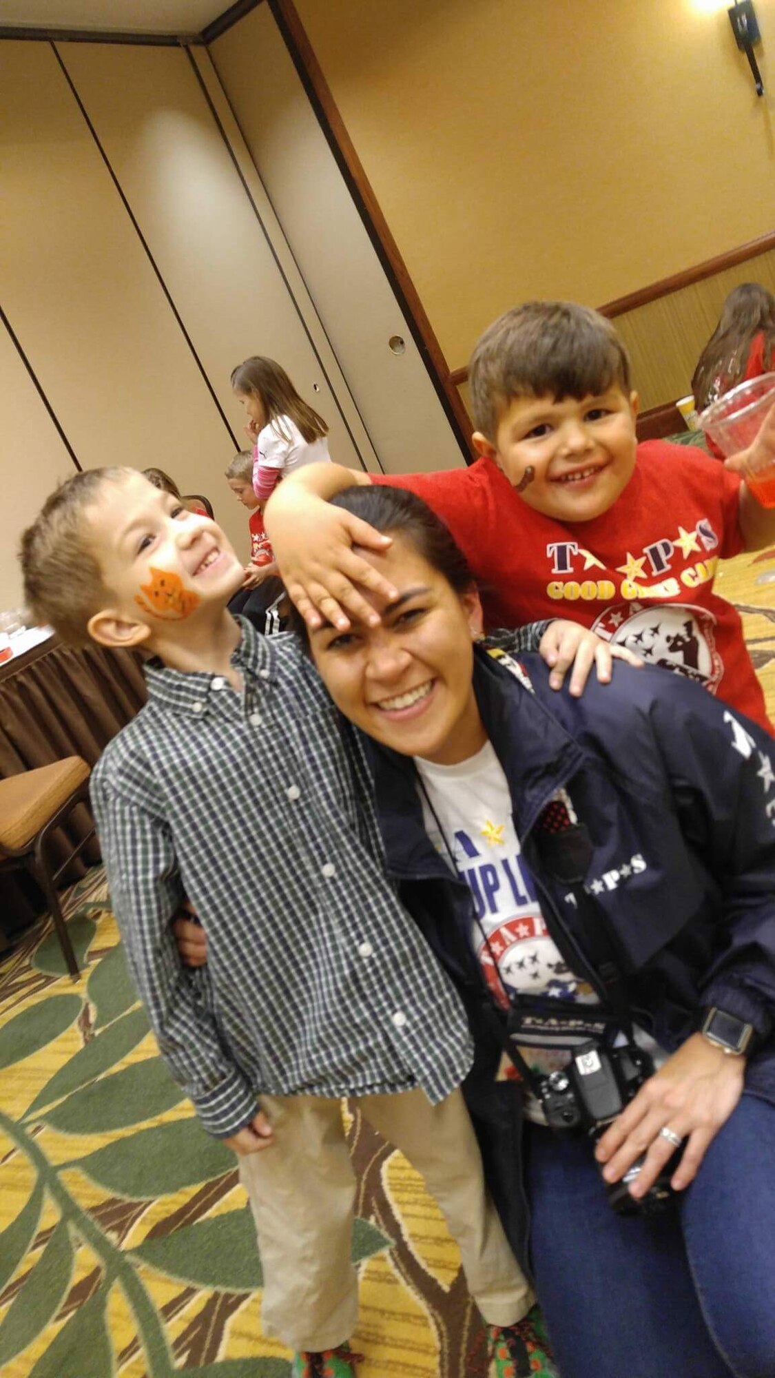 Capt. Stephanie Webb, Air Force Space Command Strategic Command flight commander, and two mentees take time out for fun during the Tragedy Assistance Program for Survivors Regional Survivor Seminar and Good Grief Camp, March 31, 2017. About 300 people attended the seminar, March 31-April 2, for those who have lost a military family member. 