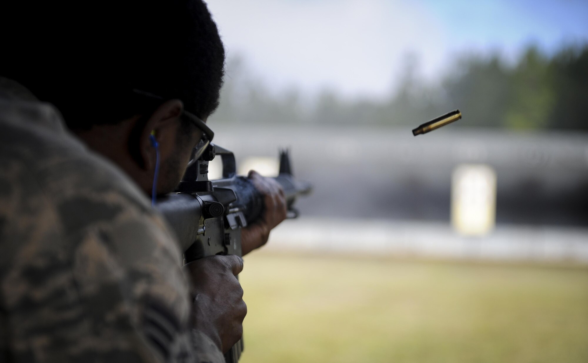 Senior Airman Arry Milcette, a crew chief with the 1st Special Operations Aircraft Maintenance Squadron, fires an M-16 rifle during a competition at Hurlburt Field, Fla., April 4, 2017. Milcette participated in the Excellence in Competition event, a rifle competition held by the 1st Special Operations Security Forces Squadron. (U.S. Air Force photo by Airman 1st Class Dennis Spain)