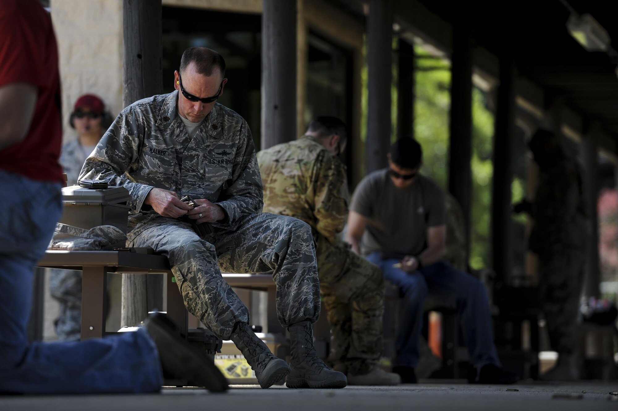 Maj. Whit Walker, director of operations with the 1st Special Operations Communications Squadron, loads ammunition into a magazine during the Excellence in Competition Event at Hurlburt Field, Fla., April 4, 2017. Over 300 Air Commandos signed up to participate in the Excellence in Competition event, a rifle shooting competition held over a three day period. (U.S. Air Force photo by Airman 1st Class Dennis Spain)