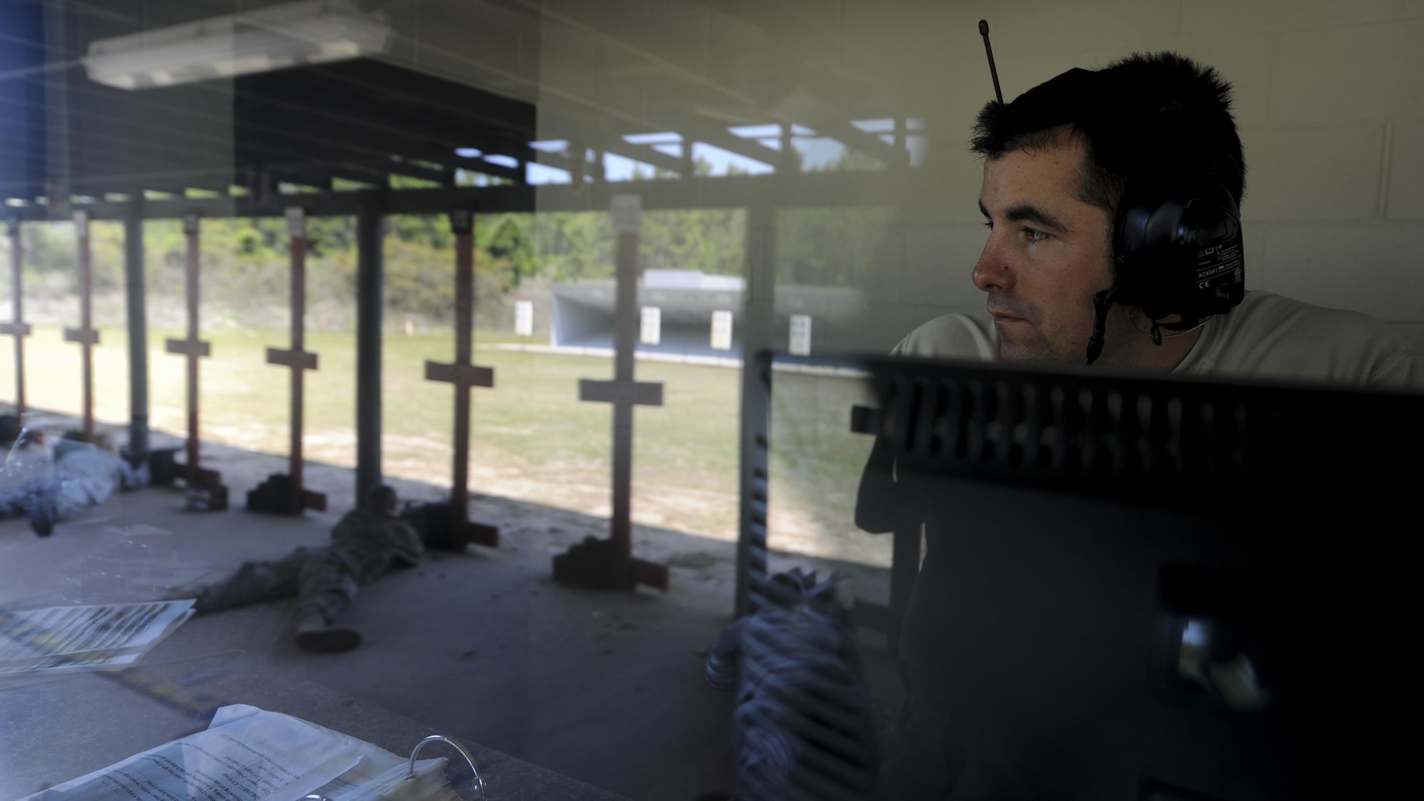 Staff Sgt. Darrin Miller, a Combat Arms Training and Maintenance instructor with the 1st Special Operations Security Forces Squadron, observes the firing line during a rifle competition at Hurlburt Field, Fla., April 4, 2017. Miller ensured procedures and safety measures were enforced during the Excellence in Competition event. (U.S. Air Force photo by Airman 1st Class Dennis Spain)