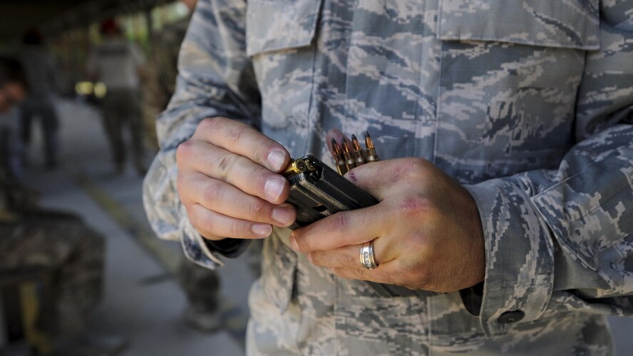 Tech. Sgt. Michael Cover, an aerospace ground equipment craftsman with the 1st Special Operations Maintenance Squadron, loads ammunition into a magazine during a rifle competition at Hurlburt Field, Fla., April 4, 2017. More than 300 Air Commandos participated in the Excellence in Competition, a rifle shooting competition, in which the top 10 percent will be awarded an Excellence in Competition Rifleman Badge. (U.S. Air Force photo by Airman 1st Class Dennis Spain)