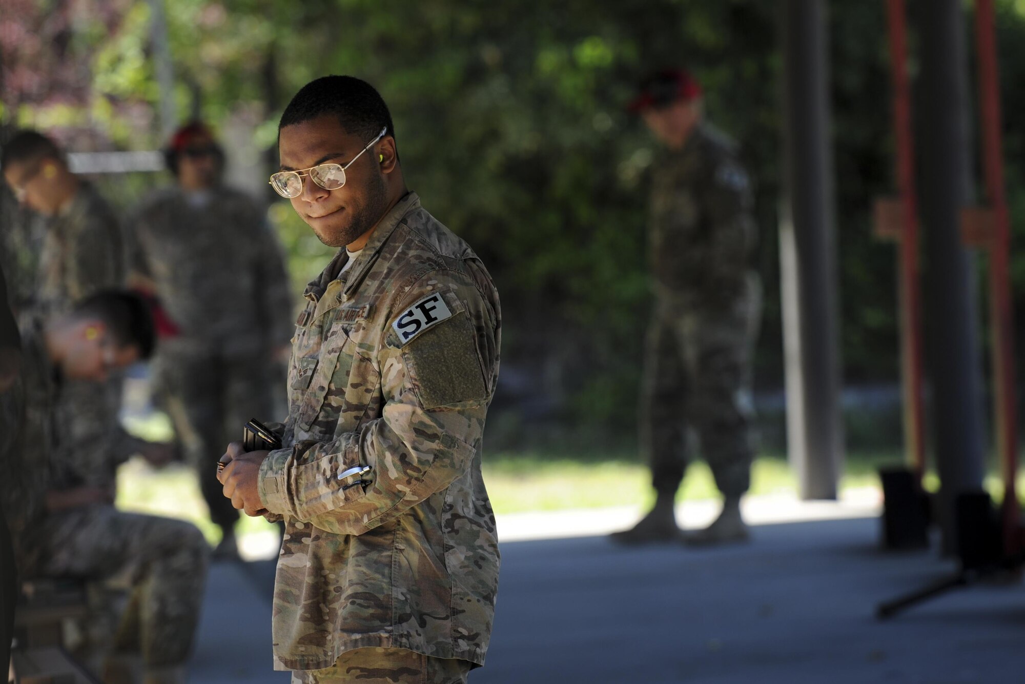 Senior Airman Chaz Stukes, a patrolman with the 1st Special Operations Security Forces Squadron, loads ammunition into a magazine at Hurlburt Field, Fla., March 6, 2017. More than 300 Air Commandos signed up to participate in the Excellence in Competition event, a rifle shooting competition held over a three-day period. (U.S. Air Force photo by Airman 1st Class Dennis Spain)