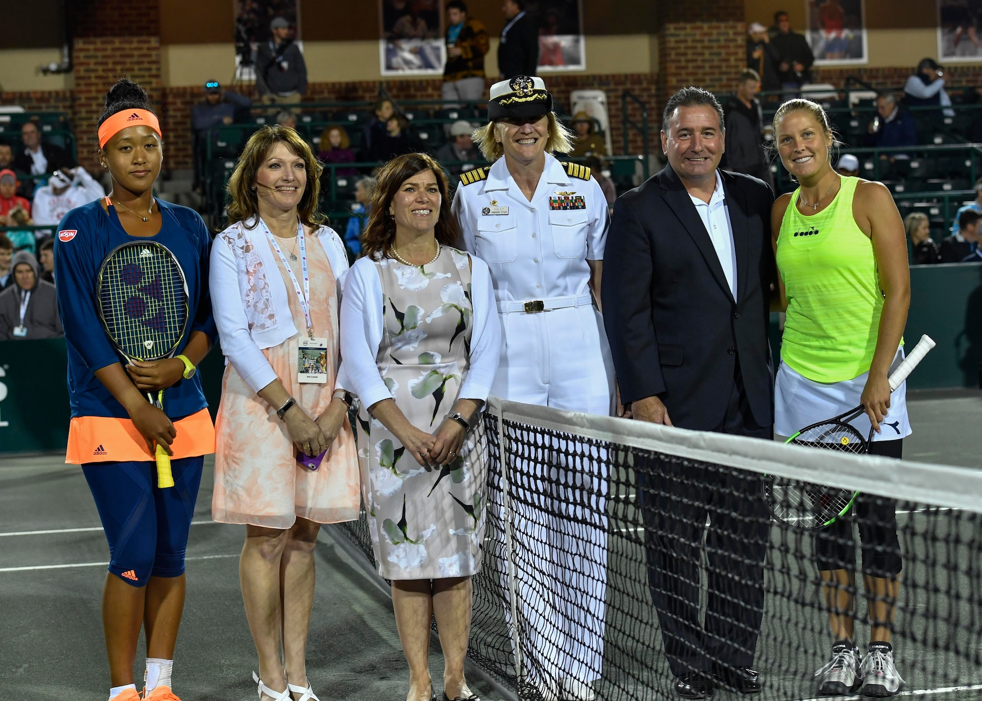 U.S. Navy Capt. Elizabeth Maley, Naval Health Clinic Charleston commander, poses for a photo after performing a coin toss during military appreciation night at the Volvo Car Open tennis tournament, April 6, 2017. Maley, U.S. Air Force Master Sgt. Toby Housey, 315th Airlift Wing Equal Opportunity superintendent, and the Joint Base Charleston Honor Guard represented JB Charleston by participating in the coin toss, singing of the national anthem and posting of colors.