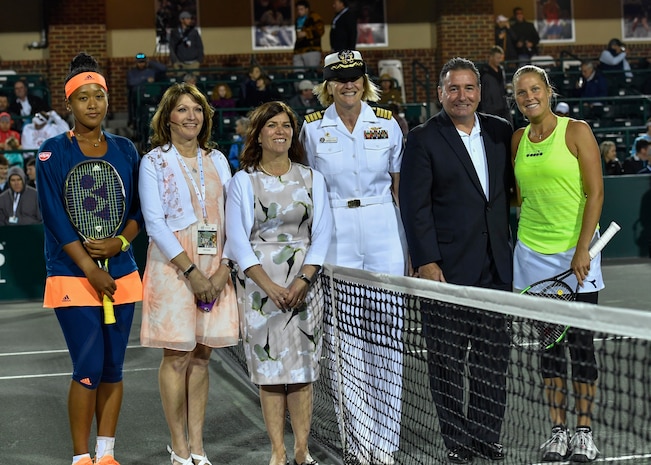 U.S. Navy Capt. Elizabeth Maley, Naval Health Clinic Charleston commander, poses for a photo after performing a coin toss during military appreciation night at the Volvo Car Open tennis tournament, April 6, 2017. Maley, U.S. Air Force Master Sgt. Toby Housey, 315th Airlift Wing Equal Opportunity superintendent, and the Joint Base Charleston Honor Guard represented JB Charleston by participating in the coin toss, singing of the national anthem and posting of colors.