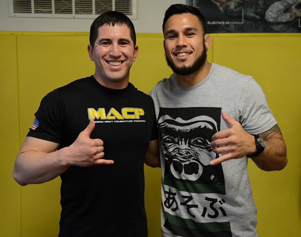 U.S. Army Spc. Johnathan Cruz, Public Health Command Fort Bragg Atlantic animal care specialist, poses for a photo with his friend Brad Tavares, UFC middleweight fighter , at Joint Base Langley-Eustis, Va., April 6, 2017. Cruz and Tavares trained in mixed martial arts together while living in Hawaii, prior to Tavares’ start in UFC and Cruz joining the Army. (U.S. Air Force photo/Staff Sgt. Teresa J. Cleveland)