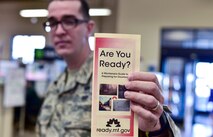 Airman 1st Class Ismael Zayas Ramos, 341st Civil Engineer Squadron readiness and emergency management flight apprentice, shares a preparedness pamphlet April 11, 2017, at Malmstrom Air Force Base, Mont. As part of this year’s America’s PrepareAthon!, held every spring and fall, the emergency management flight is hosting different events around base to help spread awareness and ensure Airmen and their families are ready for any disaster Montana may throw at them. (U.S. Air Force photo/Master Sgt. Chad Thompson)