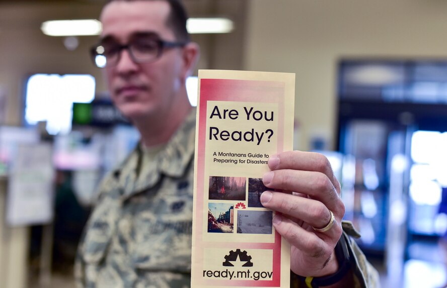 Airman 1st Class Ismael Zayas Ramos, 341st Civil Engineer Squadron readiness and emergency management flight apprentice, shares a preparedness pamphlet April 11, 2017, at Malmstrom Air Force Base, Mont. As part of this year’s America’s PrepareAthon!, held every spring and fall, the emergency management flight is hosting different events around base to help spread awareness and ensure Airmen and their families are ready for any disaster Montana may throw at them. (U.S. Air Force photo/Master Sgt. Chad Thompson)