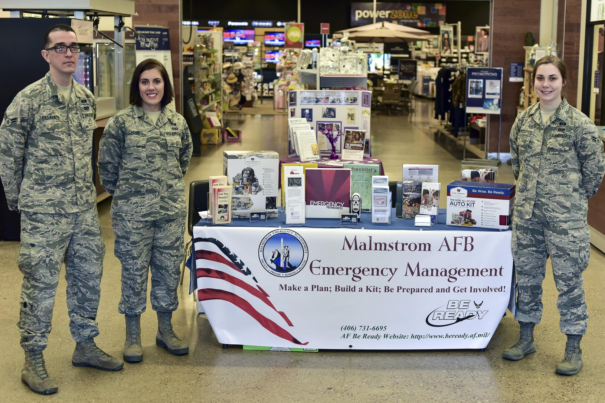 Airman 1st Class Ismael Zayas Ramos, left, Airman 1st Class Kelly LeMoine and Airman 1st Class Baylee Watercutter, all assigned to the 341st Civil Engineer Squadron’s readiness and emergency management flight, pose for a photo April 11, 2017, at Malmstrom Air Force Base, Mont. As part of this year’s America’s PrepareAthon!, held every spring and fall, the emergency management flight is hosting different events around base to help spread awareness and ensure Airmen and their families are ready for any disaster Montana may throw at them. (U.S. Air Force photo/Master Sgt. Chad Thompson)