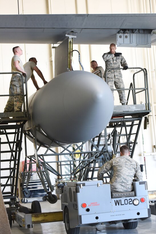 Pennsylvania Air National Guardsmen reattach an antenna pod to an EC-130J Commando Solo aircraft in a hangar in Middletown, Pa., April 5, 2017. Air National Guard photo by Master Sgt. Culeen Shaffer