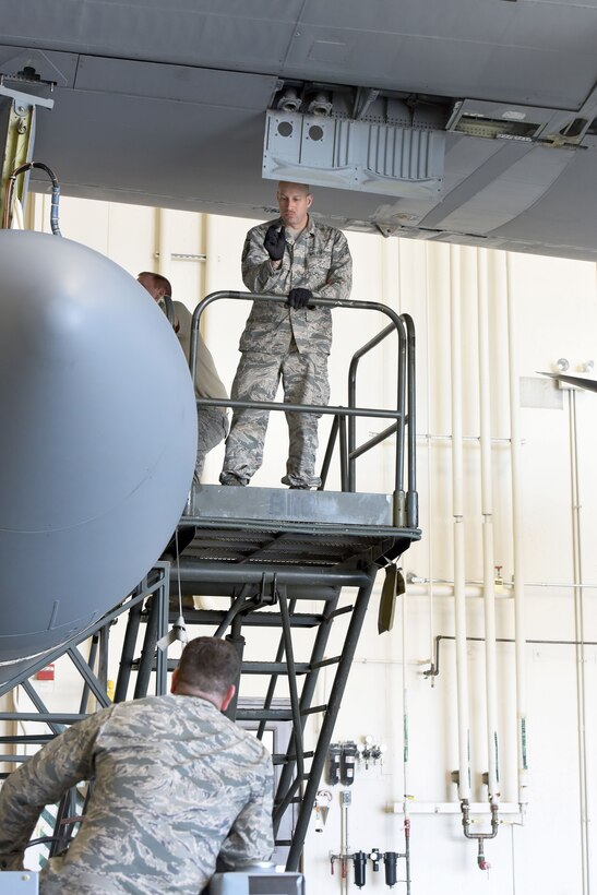 Pennsylvania Air National Guardsmen reattach an antenna pod to an EC-130J Commando Solo aircraft in a hangar in Middletown, Pa., April 5, 2017. Air National Guard photo by Master Sgt. Culeen Shaffer